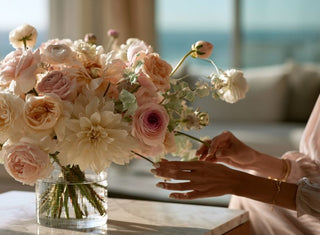 Elegant faux floral arrangement featuring blush garden roses, ivory dahlias, ranunculus, and delicate spring blooms styled in a clear glass vase by True Bloom Floral™