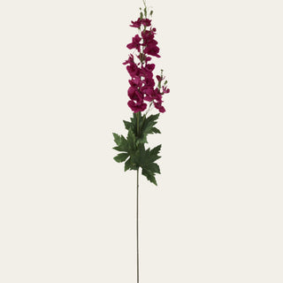 Single 36-inch Fuchsia True Bloom Real Touch delphinium stem with layered vibrant blooms, lifelike foliage, and flexible wired stem for airy floral arrangements and year-round garden-inspired styling because the bold fuchsia tone pairs beautifully with both soft neutrals and transitional seasonal palettes.