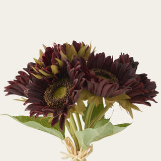 Close-up of artificial burgundy Real Touch sunflower blooms featuring layered petals and realistic botanical detail.