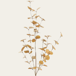 Close-up of an artificial dark yellow eucalyptus stem featuring realistic faux leaves with natural golden and brown tones for designer floral styling.
