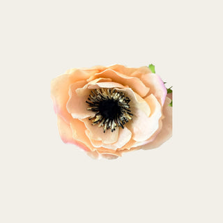 lose-up of an artificial light peach Real Touch anemone bloom highlighting realistic petal texture and detailed dark center for designer floral styling.