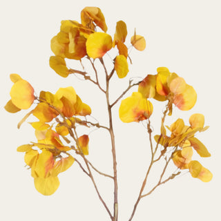 Close-up of an artificial yellow aspen branch featuring realistic faux golden leaves with warm amber tones for designer seasonal floral styling.