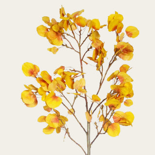 Close-up of an artificial yellow aspen branch showcasing realistic faux golden leaves with warm amber tones and detailed branching for designer seasonal floral styling.
