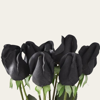 Close-up of black real touch rose buds showing the soft bud shape, dark floral surface, and realistic petal texture.