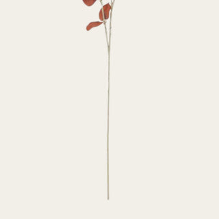 Close-up of the 35.5 inch brown and orange faux eucalyptus spray showing the flexible wired stem and realistic branch construction for shaping seasonal floral arrangements.