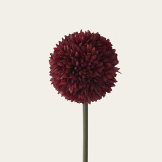 Close-up of a burgundy artificial allium bloom made with clustered polyester florets, showing its dense rounded shape and dimensional textural finish.