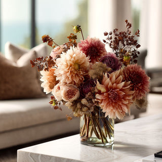dahlias in a variety of sizes. The blooms range from deep burgundy and wine tones to rust, terracotta, and soft peach. Some flowers have darker centers, while others are more uniform in color.