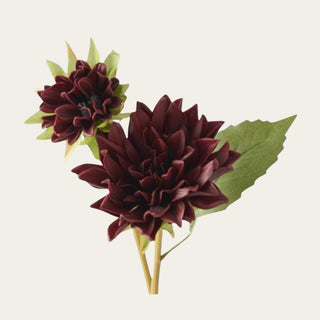 Close-up of Burgundy Real Touch Dahlia Bud & Bloom Stem showing a large layered wine-burgundy flower, smaller developing bloom, pointed soft-touch petals, green foliage, and realistic floral construction using PU, PVC, metal, and wire.