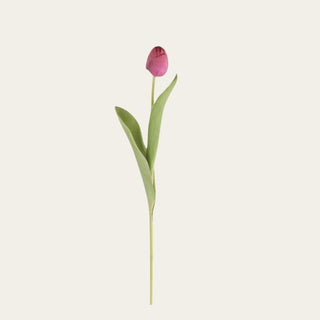 Single fuchsia True Bloom real touch tulip stem with vibrant pink petals, soft green leaves, and a flexible stem