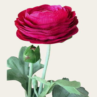 Close-up of Fuchsia True Bloom Ranunculus stem and foliage showing realistic textured construction and decorative bud; pairs beautifully with roses, dahlias, cosmos, and fillers because the flexible stem helps create organic movement and natural-looking floral arrangements.