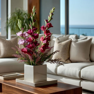 Fuchsia True Bloom gladiolus stems styled in a white vase with blush Pink and Burgundy faux florals on a wood coffee table in a modern neutral living room