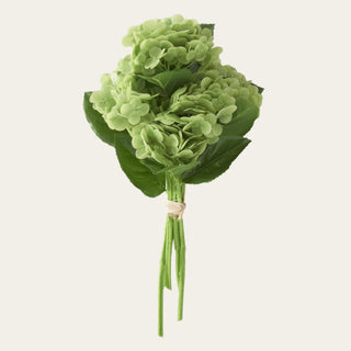 Green real touch hydrangea 6-stem bundle with soft rounded blooms, faux green leaves, and flexible stems tied together, ideal for year-round floral arrangements because the fresh green color pairs beautifully with spring florals, summer whites, fall neutrals, winter greenery, and holiday styling.