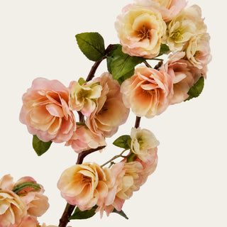 Detailed close-up of light peach and linen True Bloom Real Touch blossoms showing soft layered petals, warm peach tones, linen cream edges, and realistic floral texture for high-end faux arrangements.
