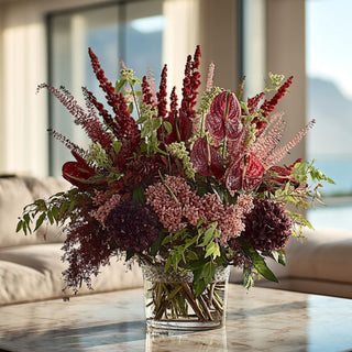 Deep tonal floral luxury faux floral arrangement for true bloom floral with a blurred background