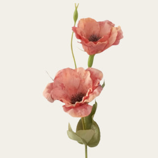 Close-up of Orange Real Touch Bellflower featuring two open blooms with softly ruffled coral-orange petals, peach undertones, darker textured centers, delicate color variation, green buds, and traditional faux foliage.
