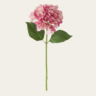 Two-Tone Mauve & Pink real touch hydrangea spray with a full rounded bloom, faux green leaves, and a faux stem, ideal for spring, summer, and early fall floral arrangements because its soft mauve tone pairs beautifully with blush, ivory, champagne, greenery, and warm transitional florals.