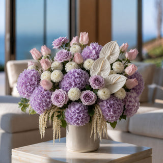 Pink True Bloom Real Touch Rose Bud Bundle styled in a cream vase with hydrangeas and complementary florals, creating a romantic arrangement filled with soft pink color, texture, and elegant year-round styling.