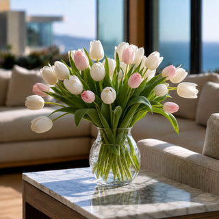 Pink True Bloom real touch tulips arranged in a white round vase with soft green leaves and naturally curved stems for a fresh year-round faux floral centerpiece.