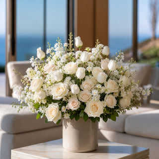 White True Bloom Real Touch rose bud bundles styled with layered white florals, blush accents, and airy greenery in an elegant arrangement perfect for year-round floral styling and holiday decorating.