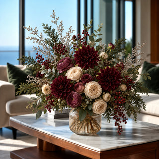 Luxury faux burgundy dahlia floral arrangement with blush roses, ranunculus and olive foliage in a glass vase for elegant late summer and fall home décor