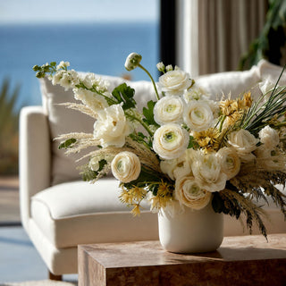 True bloom white ranunculus strem tripple blossoms mixed with other florals in a luxury floral arrangement; works beautifully in spring, summer, and fall because the saturated fuchsia blooms create focal contrast while softer florals balance the overall design.