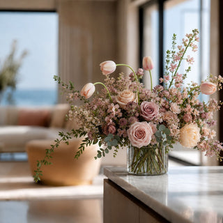 True Bloom Real Touch Mauve tulip stem Styled in a luxury floral arrangement in  vase on a marble table in a luxury modern coastal home