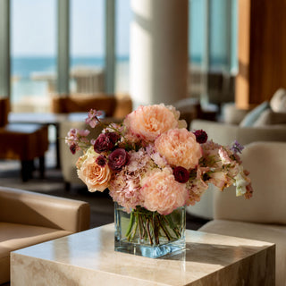 Blushed Apricot True Bloom Real Touch Peonies styled in an elegant arrangement with white florals and soft botanical accents, creating a romantic centerpiece ideal for spring styling, weddings, everyday luxury decorating, and year-round floral arrangements.