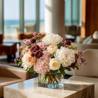 White True Bloom Real Touch Peonies styled in a romantic arrangement with blush florals and airy fillers, creating an elegant centerpiece perfect for year-round decorating, weddings, and sophisticated home styling.