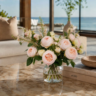 Pink True Bloom Real Touch artificial Light pink Austin Rose Stem styled in a beautiful floral arrangement on a marble coffee table in a luxury living room of  coastal home 