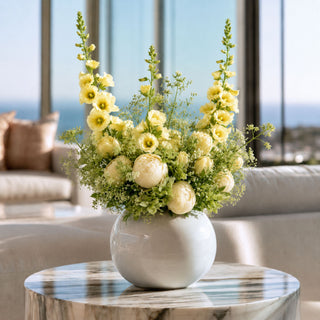 True bloom floral light yellow hollyhock stems mixed with other florals in a luxury floral arrangement; works beautifully in spring, summer, and fall because the saturated fuchsia blooms create focal contrast while softer florals balance the overall design.