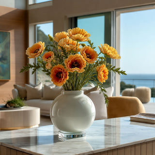 Yellow and orange Real Touch poppy bundle styled in a glass vase with greenery, creating a warm spring, summer, and fall arrangement filled with natural movement, cheerful color, and relaxed organic texture.