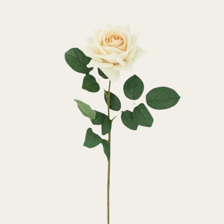Zoomed view of Pale yellow True Bloom Real Touch Duchess Rose Stem with layered garden rose petals and realistic foliage; pairs beautifully with white peonies, peach anemones, hydrangeas, and eucalyptus because the soft yellow coloring brightens arrangements while maintaining a sophisticated, balanced look across every season including holiday styling.
