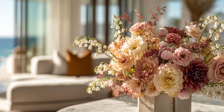 Floral arrangement in a vase with a blurred indoor background. True Bloom Floral high-end spring time floral 