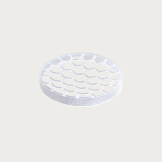 Vase Buddy flexible silicone floral grid insert shown outside packaging, designed to hold faux and fresh flower stems upright in any vase for effortless arrangement styling